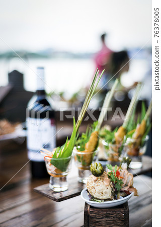 gourmet tapas snack food in modern outdoor bar at sunset gourmet tapas snack food in modern outdoor bar at sunset 76378005