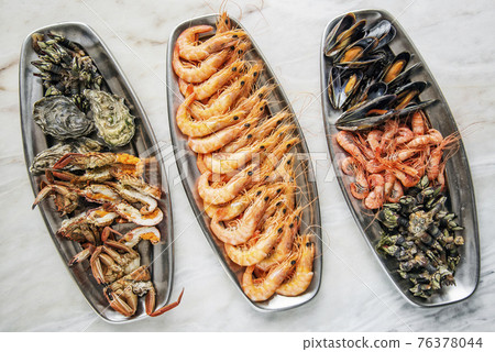 mixed fresh seafood selection gourmet set platter meal on table mixed fresh seafood selection gourmet set platter meal on table 76378044