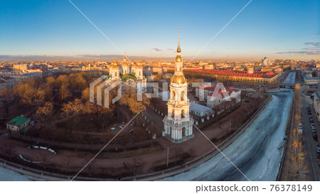 Aerial top view to St. Nicholas Naval Sea Cathedral in sunny day. Panorama of evening historical city center. Orthodox church located on banks of Kryukov and Griboyedov canal. Saint Petersburg. Russia 76378149