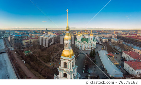 Aerial top view to St. Nicholas Naval Sea Cathedral in sunny day. Panorama of evening historical city center. Orthodox church located on banks of Kryukov and Griboyedov canal. Saint Petersburg. Russia 76378168