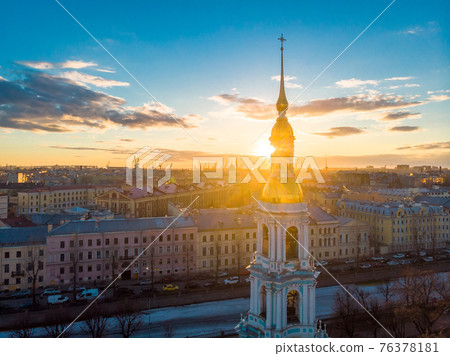 Aerial top view to St. Nicholas Naval Sea Cathedral in sunny day. Panorama of evening historical city center. Orthodox church located on banks of Kryukov and Griboyedov canal. Saint Petersburg. Russia Aerial top view to St. Nicholas Naval Sea Cathedral in sunny day. Panorama of evening historical city center. Orthodox church located on banks of Kryukov and Griboyedov canal. Saint Petersburg. Russia 76378181