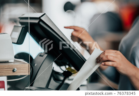 saleswoman or shopgirl printing receipt or invoice for a customer, sales time, discount period, POS concept saleswoman or shopgirl printing receipt or invoice for a customer, sales time, discount period, POS concept 76378345