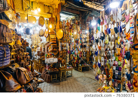 Moroccan oriental souvenirs and products on the market in the Medina of Marrakesh, Morocco 76380371