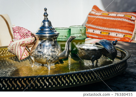 Arabian Mint Tea. Moroccan Mint Tea. The national hot drink in the Middle East and the Muslim world. Served in a special iron silver teapot with sugar. 76380455