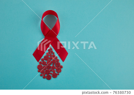 Awareness oncept with blood drop and red ribbon. World Hamophilia day or blood donor day 76380730