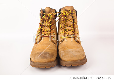 Hiking shoes and a white background, Sturdy hiking boots 76380940