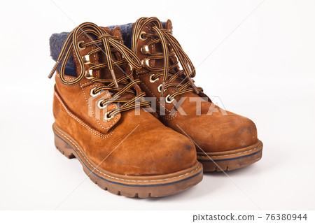 Hiking shoes and a white background, Sturdy hiking boots Hiking shoes and a white background, Sturdy hiking boots 76380944