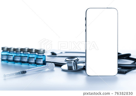 Medical screen. Hospital equipment: doctor stethoscope, hospital healthcare charts, syringe with needle and black smartphone with blank screen. Mockup generic device. Medical screen. Hospital equipment: doctor stethoscope, hospital healthcare charts, syringe with needle and black smartphone with blank screen. Mockup generic device. 76382830