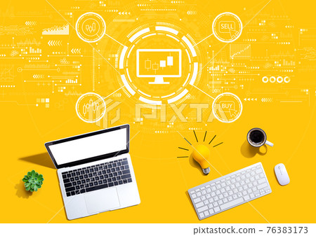 Stock trading theme with computers with a light bulb 76383173