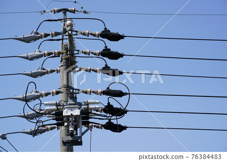 Scenery of electric wires and blue sky 76384483