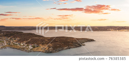 Aerial panoramic view of a town on the Rocky Atlantic Ocean Coast. 76385385