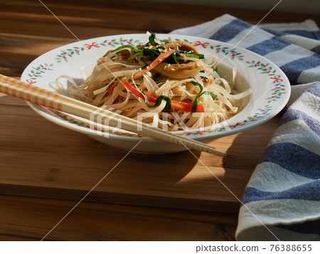 Asian food stir-fried rice noodles with vegetables 76388655