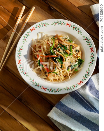 Asian food stir-fried rice noodles with vegetables Asian food stir-fried rice noodles with vegetables 76388660