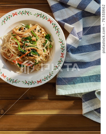 Asian food stir-fried rice noodles with vegetables Asian food stir-fried rice noodles with vegetables 76388662