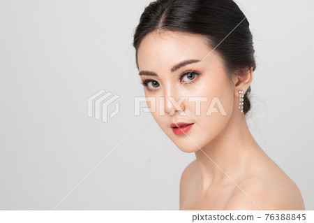 Beautiful makeup Asian woman. portrait Asian girl in studio white background. Beauty of women. Cosmetic contact lenses. Beauty and makeup concept. 76388845