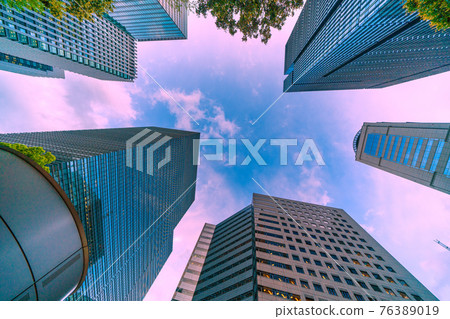 Tokyo cityscape of Japan: Overlooking the offices of Otemachi and the blue sky from the clouds (Otemachi Place on the left) 76389019