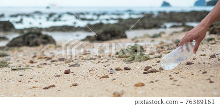 hand picking up trash