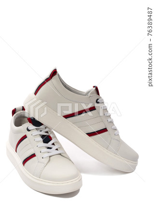 New white sports sneakers on a white background 76389487