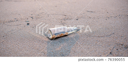 Glass Bottle garbage on the beach. Ecology, Environmental, pollution and Ecological problem concept Glass Bottle garbage on the beach. Ecology, Environmental, pollution and Ecological problem concept 76390055