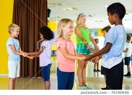 Little boys and girls dancing pair dance in the ballet studio Little boys and girls dancing pair dance in the ballet studio 76390698