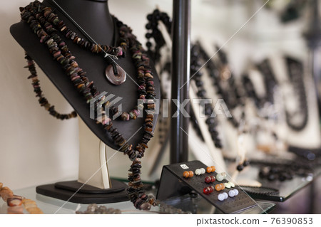 Necklaces and earrings made of natural gems at store Necklaces and earrings made of natural gems at store 76390853