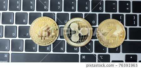 golden Cryptocurrency on keyboard laptop, Bitcoin, Zcach and Ripple coins. Crypto is Digital Money within the blockchain network golden Cryptocurrency on keyboard laptop, Bitcoin, Zcach and Ripple coins. Crypto is Digital Money within the blockchain network 76391963
