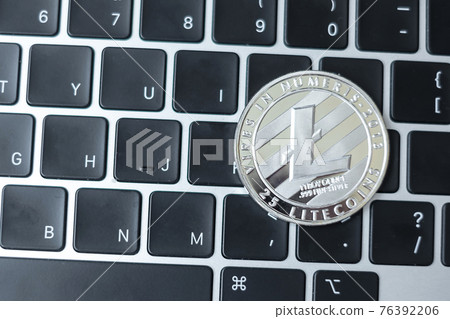silver Cryptocurrency on keyboard laptop, Litecoin coin. Crypto is Digital Money within the blockchain network silver Cryptocurrency on keyboard laptop, Litecoin coin. Crypto is Digital Money within the blockchain network 76392206