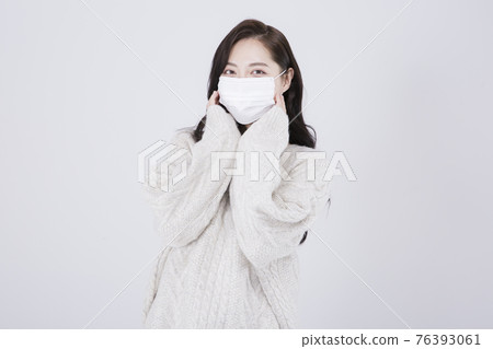 Asian female model with long hair with mask and winter fashion Asian female model with long hair with mask and winter fashion 76393061