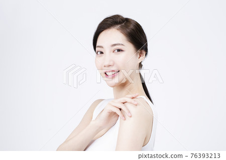 beatiful Asian woman with white sleeveless, white background shot with beauty cosmetics concept beatiful Asian woman with white sleeveless, white background shot with beauty cosmetics concept 76393213