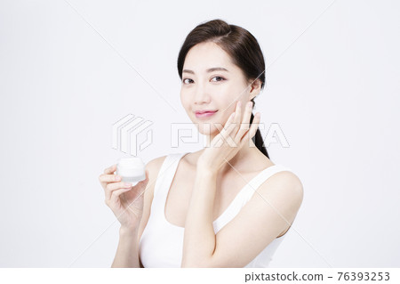 beatiful Asian woman with white sleeveless, white background shot with beauty cosmetics concept beatiful Asian woman with white sleeveless, white background shot with beauty cosmetics concept 76393253