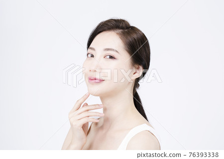 beatiful Asian woman with white sleeveless, white background shot with beauty cosmetics concept beatiful Asian woman with white sleeveless, white background shot with beauty cosmetics concept 76393338
