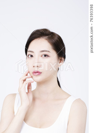beatiful Asian woman with white sleeveless, white background shot with beauty cosmetics concept beatiful Asian woman with white sleeveless, white background shot with beauty cosmetics concept 76393398
