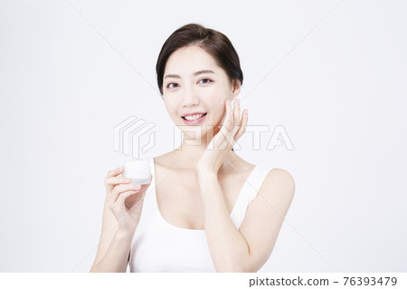 beatiful Asian woman with white sleeveless, white background shot with beauty cosmetics concept beatiful Asian woman with white sleeveless, white background shot with beauty cosmetics concept 76393479