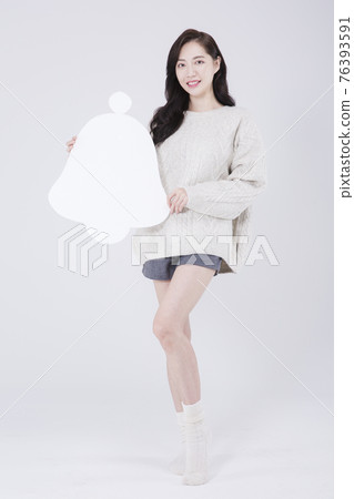 Asian female model with bell alarm object, winter beauty promotion concept Asian female model with bell alarm object, winter beauty promotion concept 76393591