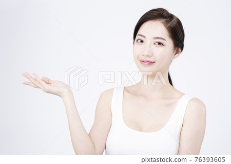 beatiful Asian woman with white sleeveless, white background shot with beauty cosmetics concept 76393605