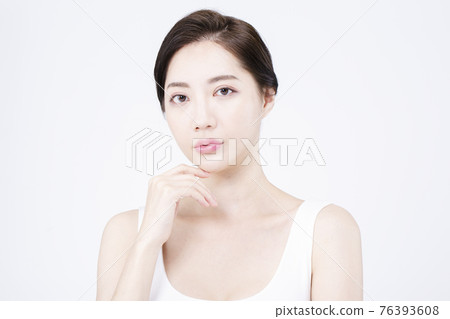beatiful Asian woman with white sleeveless, white background shot with beauty cosmetics concept beatiful Asian woman with white sleeveless, white background shot with beauty cosmetics concept 76393608