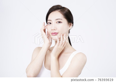 beatiful Asian woman with white sleeveless, white background shot with beauty cosmetics concept beatiful Asian woman with white sleeveless, white background shot with beauty cosmetics concept 76393619
