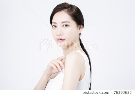 beatiful Asian woman with white sleeveless, white background shot with beauty cosmetics concept beatiful Asian woman with white sleeveless, white background shot with beauty cosmetics concept 76393623