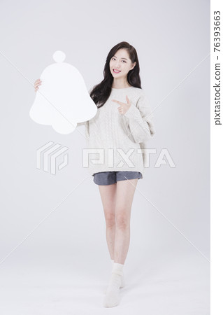 Asian female model with bell alarm object, winter beauty promotion concept Asian female model with bell alarm object, winter beauty promotion concept 76393663
