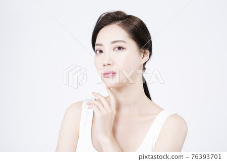 beatiful Asian woman with white sleeveless, white background shot with beauty cosmetics concept beatiful Asian woman with white sleeveless, white background shot with beauty cosmetics concept 76393701