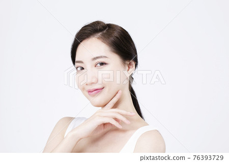 beatiful Asian woman with white sleeveless, white background shot with beauty cosmetics concept beatiful Asian woman with white sleeveless, white background shot with beauty cosmetics concept 76393729