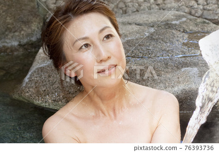 A woman in a hot spring A woman in a hot spring 76393736