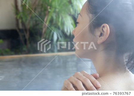 A woman in a hot spring A woman in a hot spring 76393767