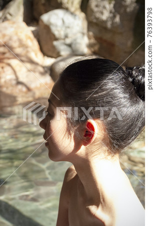 A woman in a hot spring A woman in a hot spring 76393798