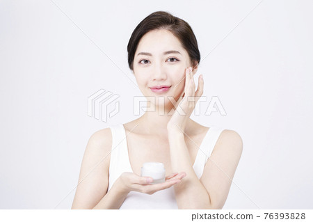beatiful Asian woman with white sleeveless, white background shot with beauty cosmetics concept beatiful Asian woman with white sleeveless, white background shot with beauty cosmetics concept 76393828