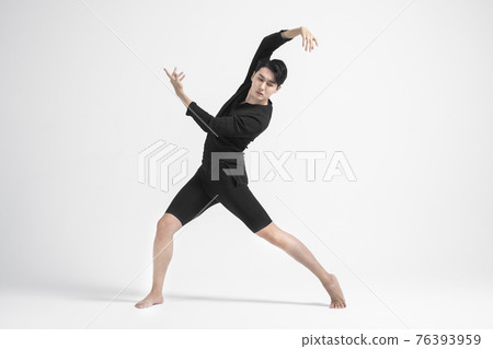 contemporary asian male dancer making move in white background contemporary asian male dancer making move in white background 76393959