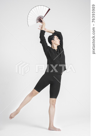contemporary asian male dancer making move in white background contemporary asian male dancer making move in white background 76393989