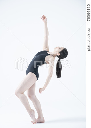 contemporary Asian female dancer making move in white background contemporary Asian female dancer making move in white background 76394110