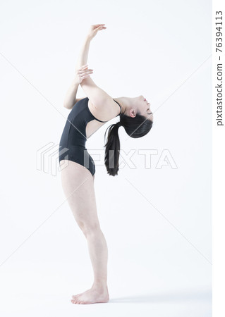 contemporary Asian female dancer making move in white background contemporary Asian female dancer making move in white background 76394113
