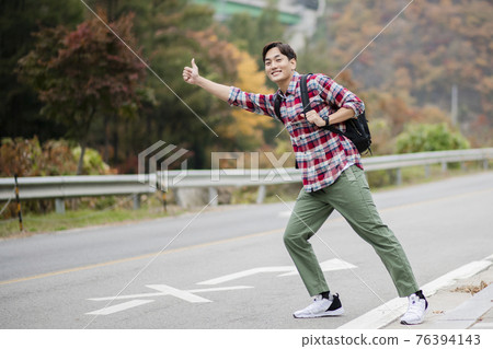 handsome Asian male model autumn travel concept 76394143